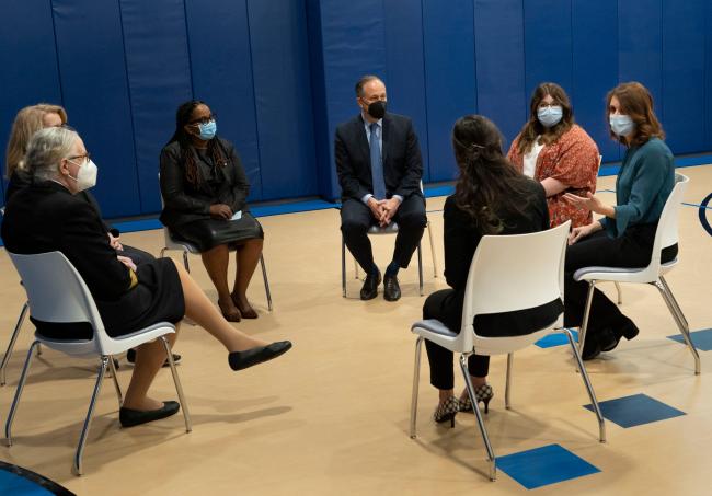 A meeting of a diverse group of people enjoying a presentation